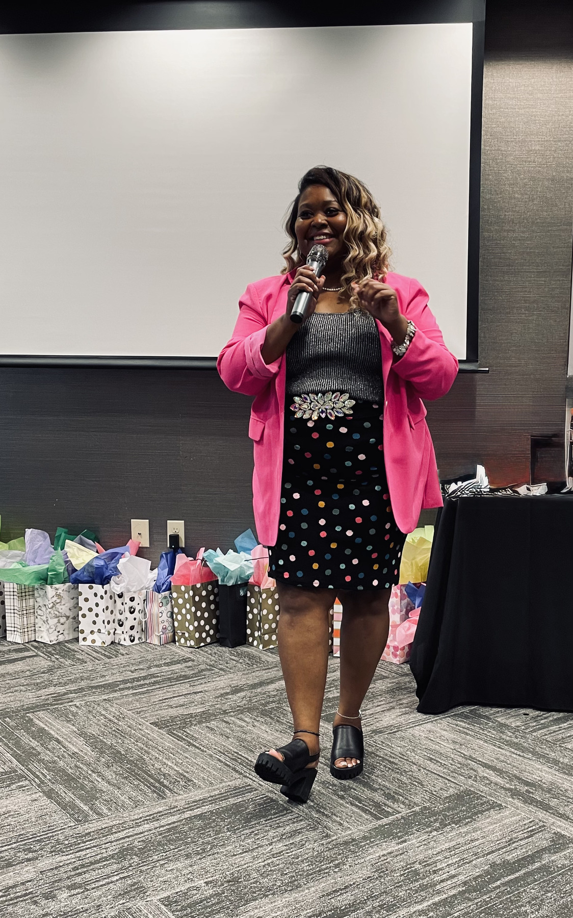 Dr. Carolyn speaking at a live event